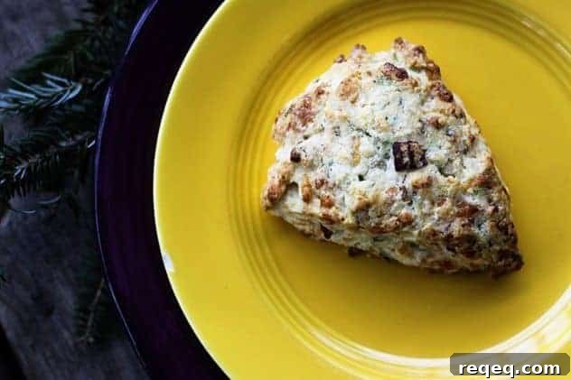 Having a bag of frozen pre-formed Bacon Cheddar Scallion Scones in the oven is your secret holiday breakfast or brunch weapon to having piping hot, tender, flaky scones studded with crispy bacon, minced scallion and tiny pockets of melted Cheddar cheese.