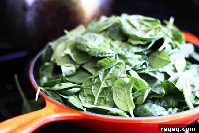 Spinach and Feta Turkey Burger Recipe for Juicy Flavor 3 Sweating spinach for Spinach Feta Turkey Burger | www.foodiewithfamily.com