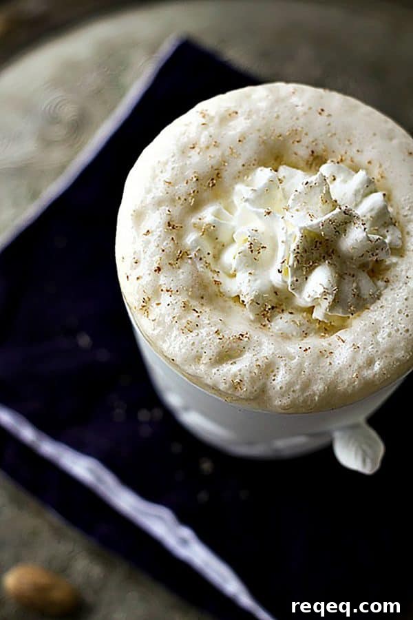 Eggnog Chai Latte Recipe — Creamy Holiday Coffee Twist 3 Starbucks knockoff Creamy frothy Eggnog Chai Latte from foodiewithfamily.com