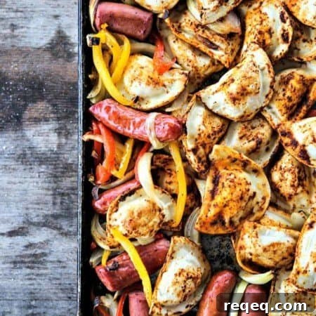 Kielbasa and Pierogies Sheet Pan Meal with juicy roasted kielbasa, crisp tender peppers and onions and puffy, potato filled pierogies.