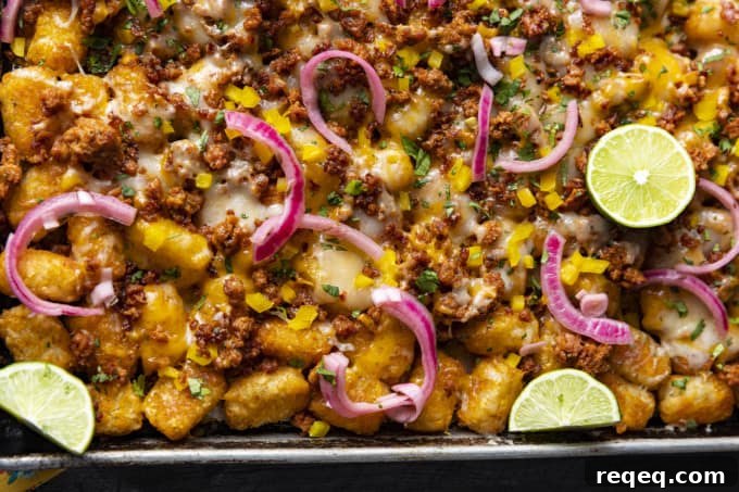 Change up Nacho Night by serving crave-ably good Tater Tot Nachos a.k.a. Totchos. These irresistible crispy baked tots are topped with spicy Chorizo, gooey melted Cheddar, pickled onions, and other nacho goodies!