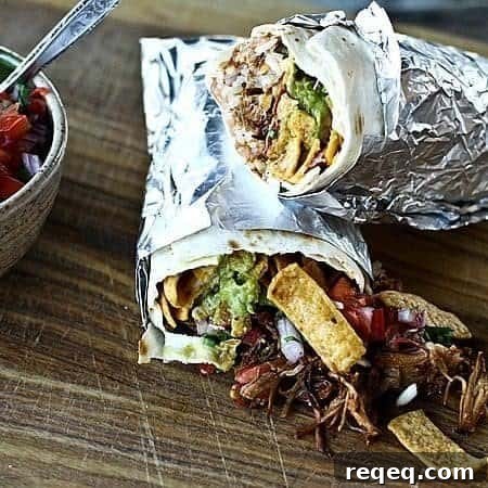 Neato Frito Overstuffed Burrito with pulled pork, guacamole, refried beans, rice, Fritos, cheese, Ranch dressing, and barbecue sauce.