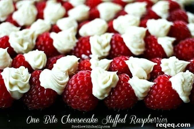 Mini Cheesecake-Stuffed Raspberries: Bite-Sized Dessert Recipes 2 One Bite Cheesecake Stuffed Rasperries with Chambord foodiewithfamily.com #cheesecake #Dessert