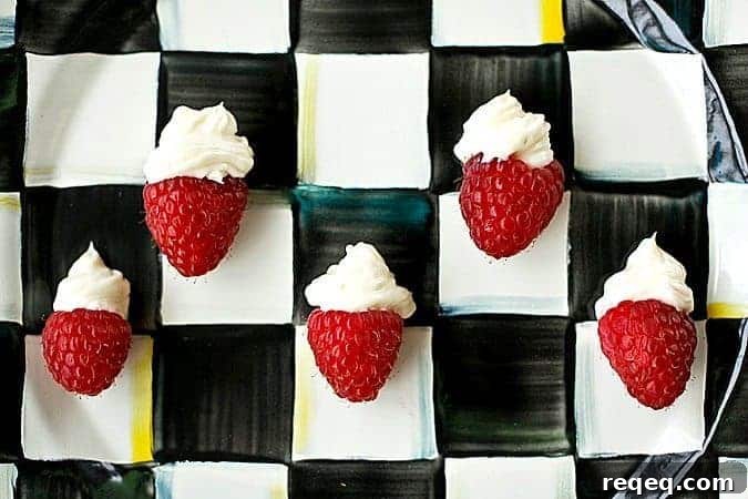 Mini Cheesecake-Stuffed Raspberries: Bite-Sized Dessert Recipes 3 One Bite Cheesecake Stuffed Rasperries with Chambord foodiewithfamily.com #cheesecake #Dessert