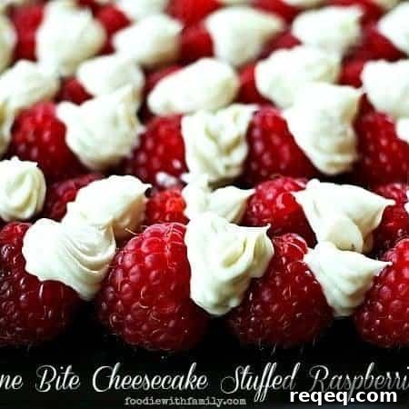 Mini Cheesecake-Stuffed Raspberries: Bite-Sized Dessert Recipes 5 One Bite Cheesecake Stuffed Rasperries with Chambord foodiewithfamily.com #cheesecake #Dessert