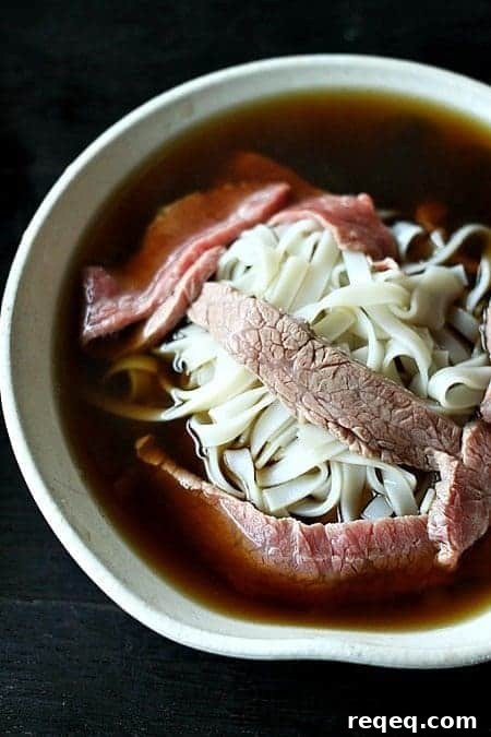 Pho: Authentic Vietnamese Beef Noodle Soup Recipe 9 Pho or Vietnamese Beef Noodle Soup waiting for garnish from foodiewithfamily.com