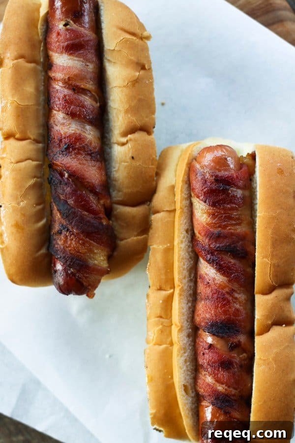 Smoky Bacon-Wrapped Hot Dogs with Crispy Grill Finish 3 Bacon Wrapped Hot Dogs are chewy, crisp, bacon-wrapped, juicy hot dogs and are worth every second of the tiny bit of extra effort they take.