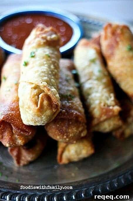 Barbecue Chicken & Bacon Egg Rolls with Melted Cheddar 2 Crispy Cheesy Barbecue Chicken and Bacon Eggrolls from foodiewithfamily.com #spon #cheese