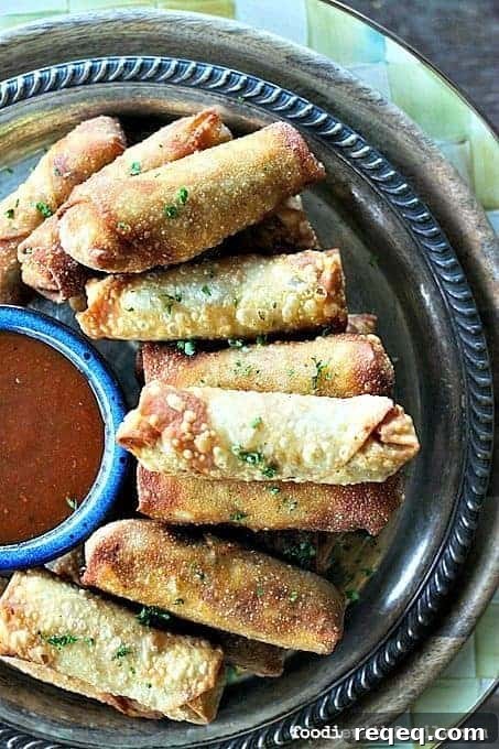 Barbecue Chicken & Bacon Egg Rolls with Melted Cheddar 3 Crunchy egg roll wrappers around a cheesy, bacon studded, barbecue chicken filling will keep you wanting more Cheesy Barbecue Chicken and Bacon Egg Rolls!