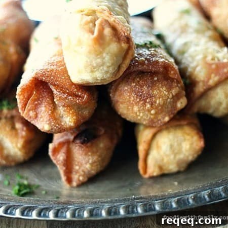 Crunchy egg roll wrappers around a cheesy, bacon studded, barbecue chicken filling will keep you wanting more Cheesy Barbecue Chicken and Bacon Egg Rolls!