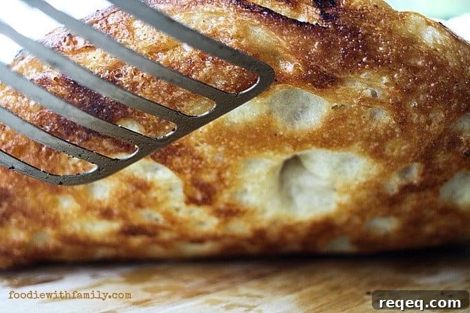 Pan Pizza Guide: How It’s Made, Why It Works, and Topping Ideas 6 The crust on Preparing dough for The Best Pan Pizza {super easy!} from foodiewithfamily.com
