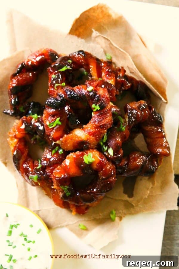 Crispy Bacon-Wrapped Onion Rings Recipe for Game Day Snacks 2 Easy Bacon Wrapped Onion Rings from foodiewithfamily.com