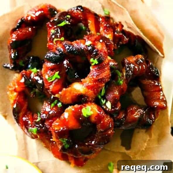 Crispy Bacon-Wrapped Onion Rings Recipe for Game Day Snacks 6 Easy Bacon Wrapped Onion Rings from foodiewithfamily.com