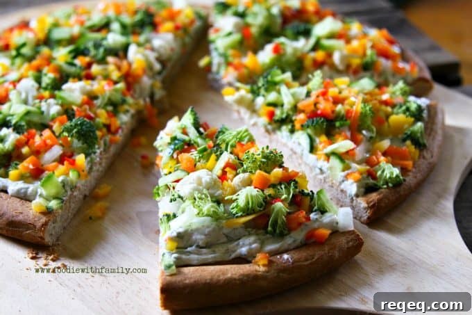 Ranch Cream Cheese Veggie Pizza Recipe 3 Snacky Ranch Cream Cheese Vegetable Pizza from foodiewithfamily.com