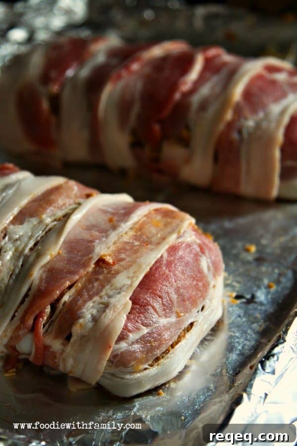 Bacon wrapped around Bacon Jalapeno Meatloaf from foodiewithfamily.com