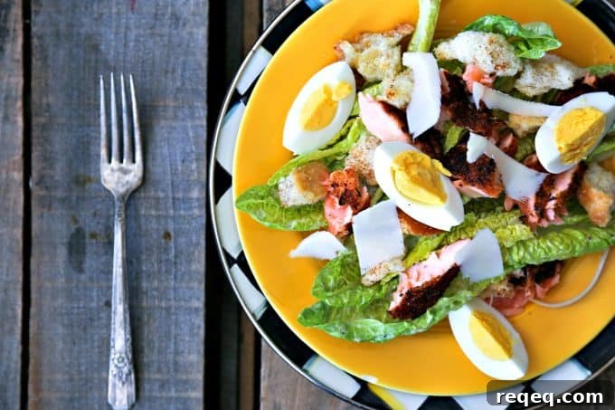 Blackened Salmon Caesar Salad Recipe for Grilled Fish Lovers 6 Simple, fresh, and filling main dish salad for spring! Blackened Salmon Caesar Salad with torn croutons, hard boiled egg, homemade dressing, and flaked blackened salmon gives the traditional Caesar salad a flavourful facelift!