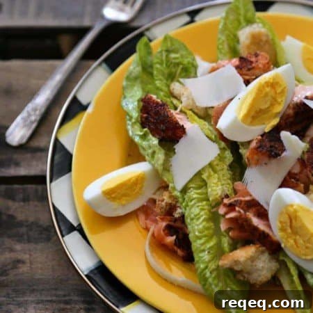 Blackened Salmon Caesar Salad hard boiled eggs Parmesan from foodiewithfamily.com