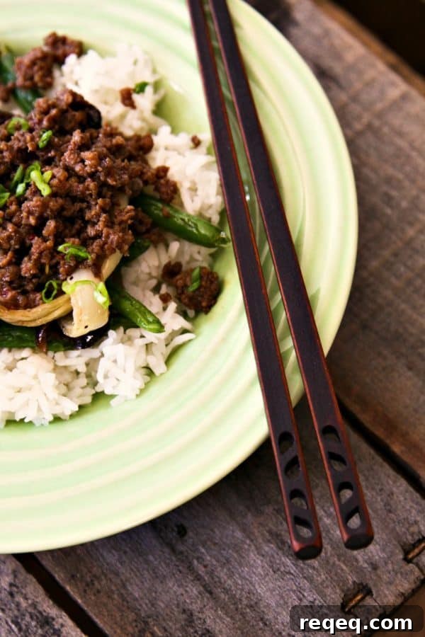 15-Minute Korean Beef Stir-Fry with Garlic and Sesame 4 15 Minute Korean Style Beef over rice, roasted ginger sesame green beans, and roasted onions from foodiewithfamily.com