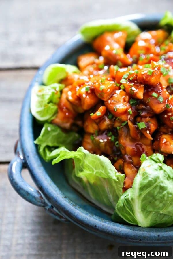 Honey Sriracha Glazed Salmon Bites – Sweet Spicy Salmon Skewers 2 Honey Sriracha Glazed Salmon Bites: Tender salmon tossed in a sticky, sweet, spicy mahogany sauce. Serve in lettuce wraps, or on hot rice.