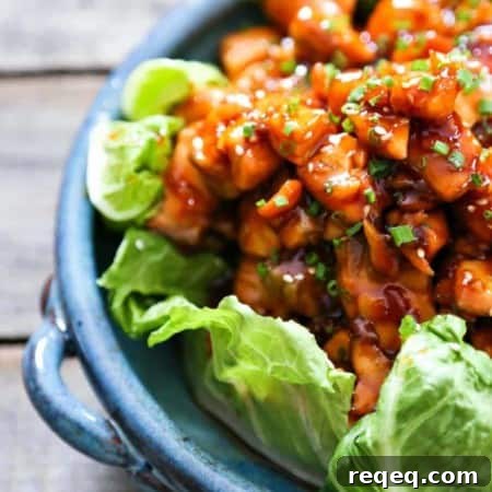 Honey Sriracha Glazed Salmon Bites – Sweet Spicy Salmon Skewers 5 Honey Sriracha Glazed Salmon Bites: Tender salmon tossed in a sticky, sweet, spicy mahogany sauce. Serve in lettuce wraps, or on hot rice.