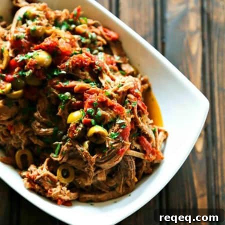 Tender Slow Cooker Shredded Beef Recipe for Sandwiches & Tacos 5 Slow Cooker Italian Shredded Beef full of sun dried tomatoes, wine, garlic, fire roasted tomatoes, olives, and capers from foodiewithfamily.com