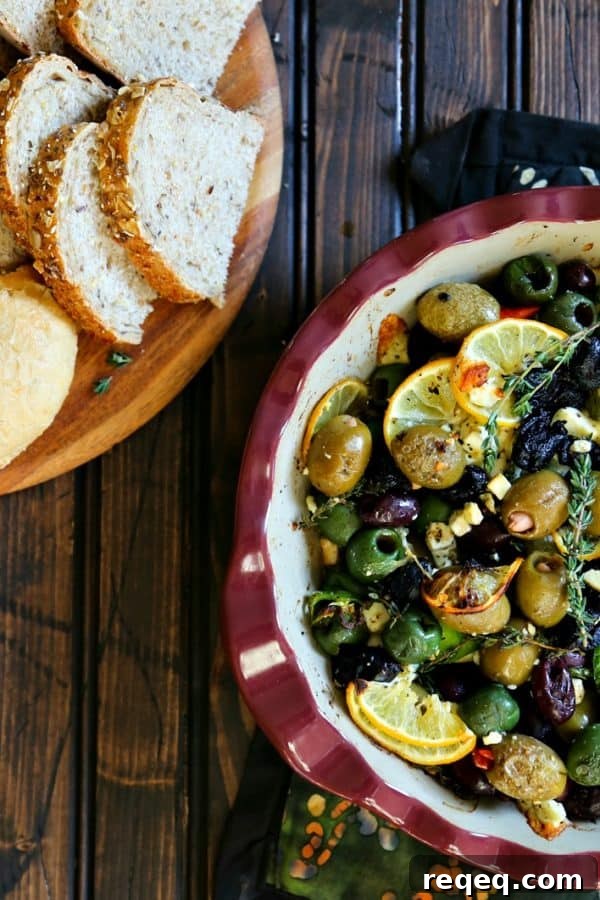 Roasted Garlic Olives Recipe: Savory Marinated Snack or Appetizer 2 Garlic Roasted Olives with lemon, thyme, feta, and peppers