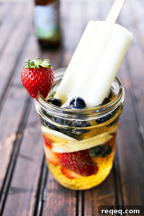 Hard Cider Sangria by the Glass: Refreshing Apple Cocktail Recipe 2 Hard Cider Sangria-by-the-Glass is fresh fruits soaked in crisp hard cider with a lime ice pop stir stick.