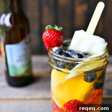 Hard Cider Sangria by the Glass: Refreshing Apple Cocktail Recipe 4 Hard Cider Sangria-by-the-Glass is fresh fruits soaked in crisp hard cider with a lime ice pop stir stick.