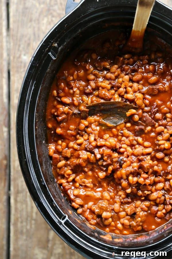 Slow-Cooker Breakfast Baked Beans with Bacon and Maple 2 Maple and coffee flavoured Slow-Cooker Breakfast Baked Beans full of Canadian Bacon and breakfast sausage from foodiewithfamily.com