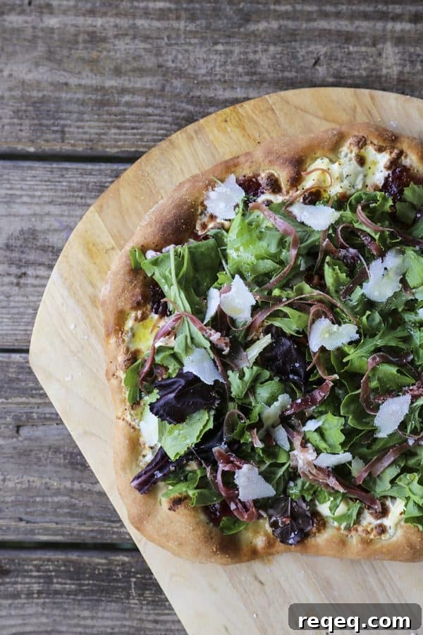 Tuscan Fig & Prosciutto Pizza with Arugula and Balsamic 2 Figgy Pig Pizza - Tuscan Style Prosciutto, fig jam, and greens pizza from foodiewithfamily.com #client #DaVinciStoryteller