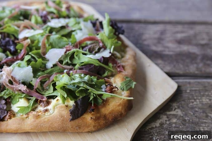 Tuscan Fig & Prosciutto Pizza with Arugula and Balsamic 5 Figgy Pig Pizza - Tuscan Style Prosciutto, fig jam, and greens pizza from foodiewithfamily.com #client #DaVinciStoryteller