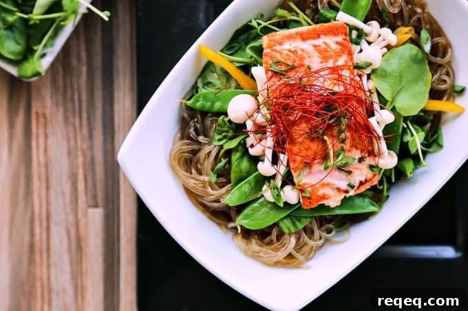 Asian Salmon Noodle Bowls with Greens and Sesame Ginger Dressing 2 Salmon + Greens Asian Noodle Bowls from foodiewithfamily.com with glass noodles