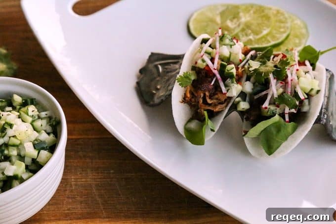 Crispy Jicama Tacos with Fresh Lime & Avocado crema 4 Jicama Tacos with carnitas, cucumber onion salsa, radishes, and cilantro.