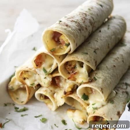 Baked Breakfast Taquitos with ham, eggs, pepperjack, and scallions.