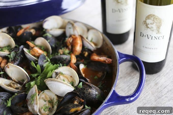 It had humble beginnings as a fisherman's stew, but this gorgeous Cioppino or Italian Seafood Stew is now a showstopper of a main dish. Serve on its own or as part of your Feast of the Seven Fishes. #sponsored