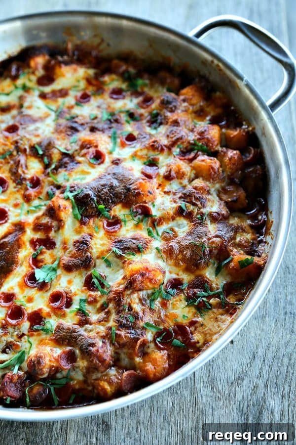 Pepperoni Pizza Gnocchi is all the flavours of pizza in pillowy gnocchi sauteed in a little butter; ; garlicky pizza sauce, pepperoni, stirred into the gnocchi, covered with a generous layer of melted mozzarella, pepperoni, and a shower of fresh parsley. Bonus: It's braces friendly!