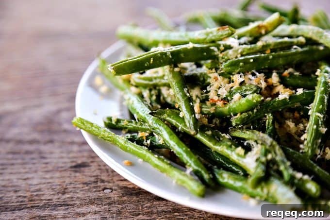 Crispy Garlic Parmesan Green Beans Recipe 4 Garlic Parmesan Green Beans: Simple roasted green beans irresistibly coated in crispy garlic, parmesan breadcrumbs.