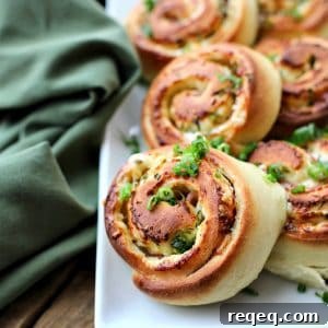 Hot Ham and Cheese Rolls: best bread dough wrapped around smoky ham, piles of Cheddar cheese, and green onions, sliced, and baked to tender perfection.