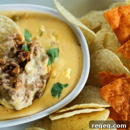 Spicy Chili con Queso Dip Recipe for Parties and Game Day 6 Ooey-gooey, chile studded heavenly queso smothers your favourite chili for a bowl of the ultimate Chili Con Queso Dip. Get those chips ready to go!