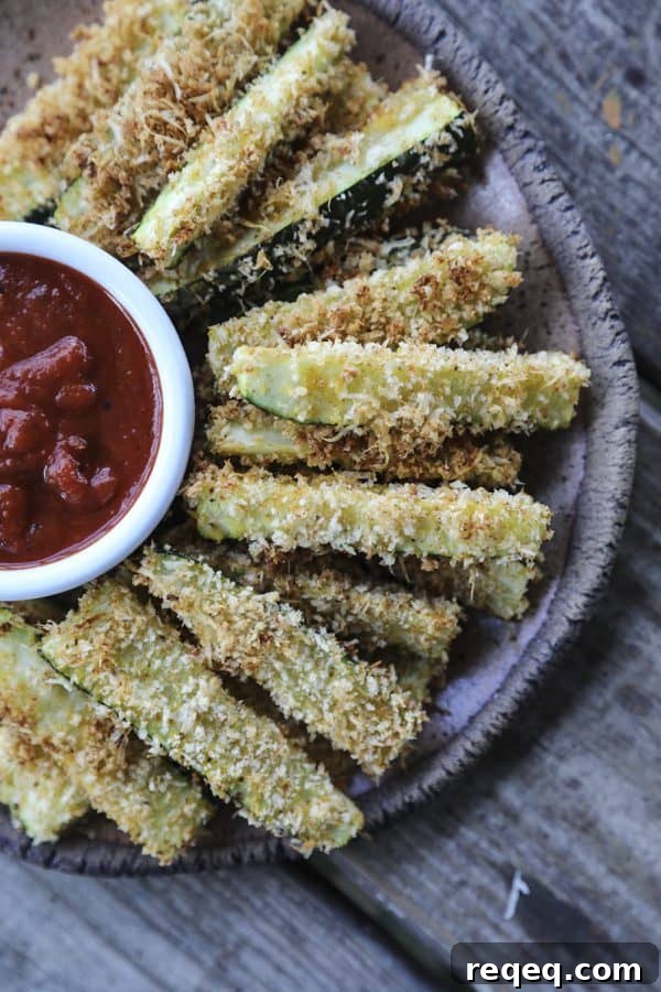 Crispy Parmesan Zucchini Fries Baked to Golden Perfection 2 Crispy, crunchy, and absolutely habit-forming; Crispy Baked Parmesan Zucchini Fries.