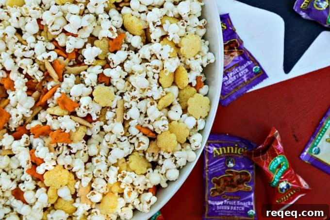 Cheddar Lover’s Popcorn Snack Mix Recipe for Cheese Fans 2 The Ultimate Cheddar Lover's Popcorn Snack Mix is full of cheddar popcorn, two kinds of cheddar crackers, cheddar puffs, and boxed cheddar snack mix. This is sure to banish those after-school snack attacks with style!