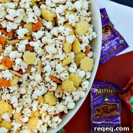 The Ultimate Cheddar Lover's Popcorn Snack Mix is full of cheddar popcorn, two kinds of cheddar crackers, cheddar puffs, and boxed cheddar snack mix.