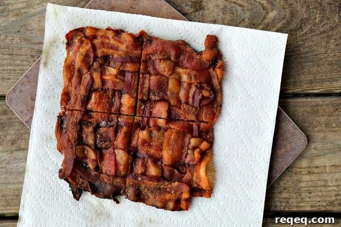 Low-Carb Swiss Bacon Burger Buns Recipe 8 Assembled bacon bun burger with Swiss cheese melting.