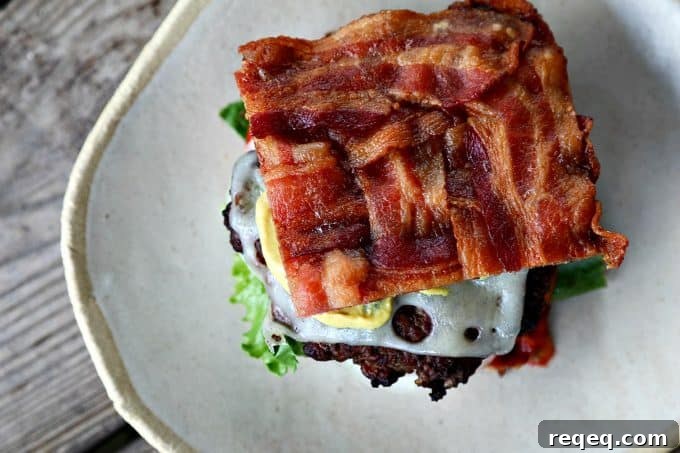 Low-Carb Swiss Bacon Burger Buns Recipe 9 Plated low-carb bacon bun Swiss burgers.
