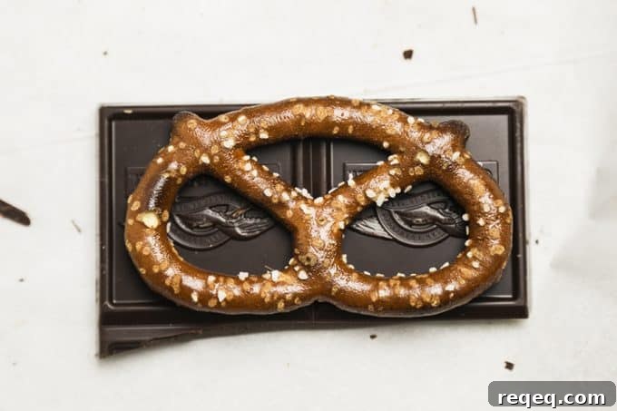 Chocolate Covered Caramel Stuffed Pretzels; crunchy sourdough pretzels enrobed in dark chocolate with a sprinkling of flaky sea salt that ooze perfectly gooey caramel when you bite into them.Chocolate Covered Caramel Stuffed Pretzels; crunchy sourdough pretzels enrobed in dark chocolate with a sprinkling of flaky sea salt that ooze perfectly gooey caramel when you bite into them.