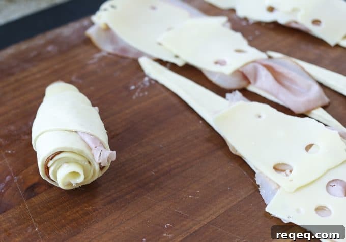 Ham & Cheese Croissants: Flaky Homemade Recipe for Breakfast 3 Ham and Cheese Croissants: homemade butter pastry is wrapped around tender ham and Swiss cheese and baked to brown, flaky perfection.