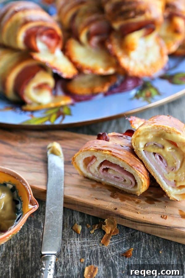 Ham & Cheese Croissants: Flaky Homemade Recipe for Breakfast 5 Ham and Cheese Croissants: homemade butter pastry is wrapped around tender ham and Swiss cheese and baked to brown, flaky perfection.