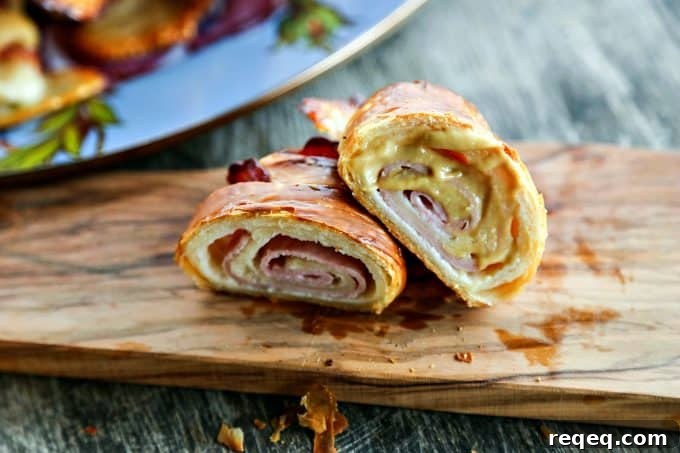 Ham & Cheese Croissants: Flaky Homemade Recipe for Breakfast 6 Ham and Cheese Croissants: homemade butter pastry is wrapped around tender ham and Swiss cheese and baked to brown, flaky perfection.