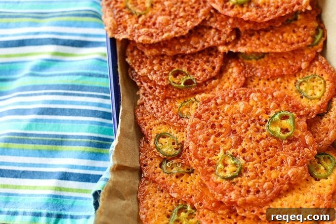 Cracklingly crisp, spicy 2-Ingredient Jalapeno Popper Crisps are a fabulously simple cracker for soups, stews, and salads. Bonus: They're low-carb, too!