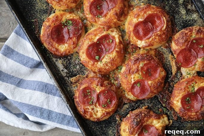 Pepperoni Bialys Recipe: Savory Pizza-Style Baked Rolls 3 Pepperoni Pizza Bialys: fresh-from-the-oven, chewy, bagel-like bread topped with chopped garlic, a hint of pizza sauce and olive oil, melted cheese, and crisp pepperoni.